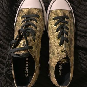 Converse Camo and gold glitter shoes.